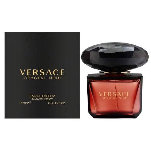 Versace Crystal Noir Eau de Parfum 90ml bottle next to its black packaging box with gold lettering, on a plain white background.