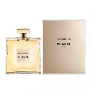 Chanel Gabrielle perfume bottle with a gold cap next to its beige packaging box, on a white background.